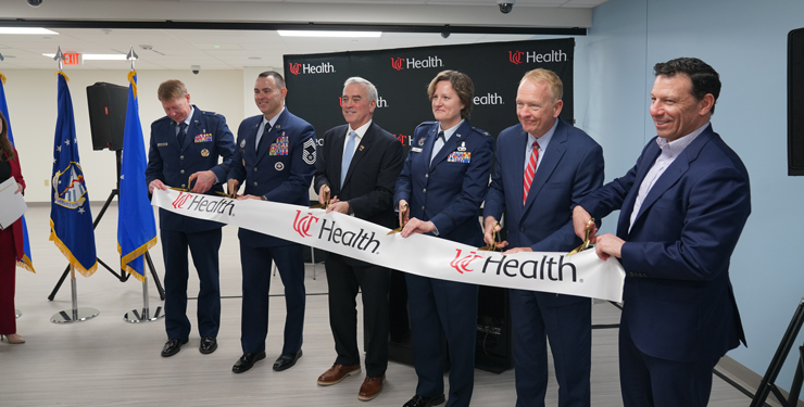 People cutting the ribbon at the UC Health DARRIO Simulation Center Grand Opening