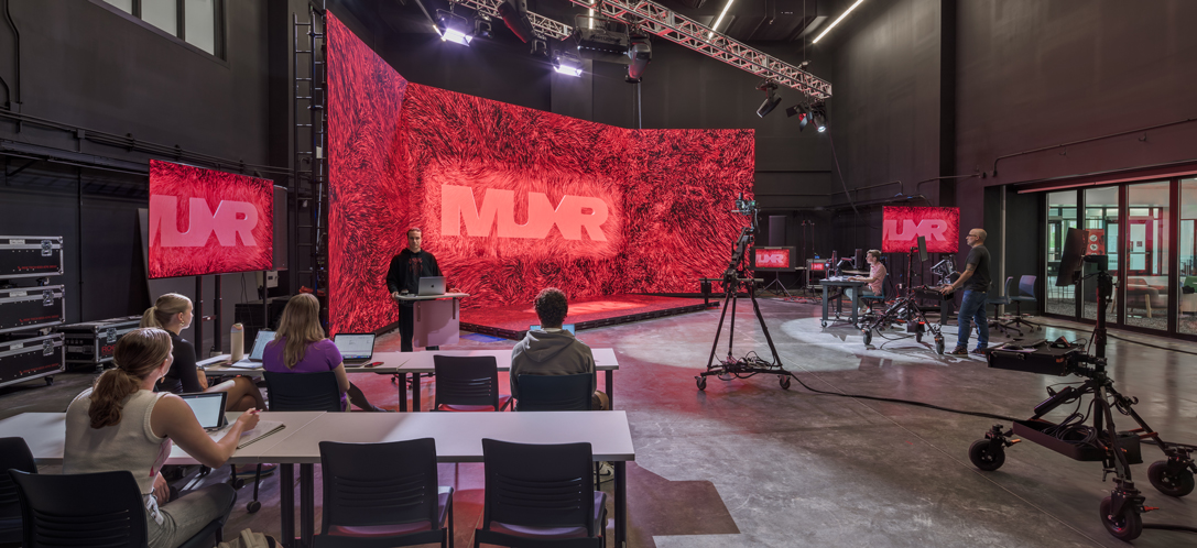 The XR Stage in the McVey Data Science Building at Miami University in Oxford, Ohio displays research as people pass by.