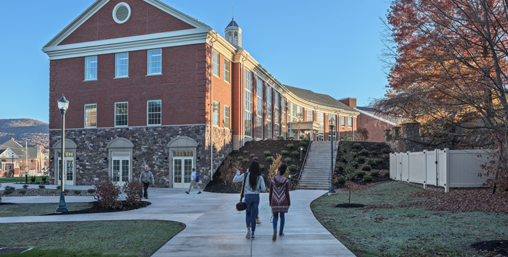 Two students walking through campus