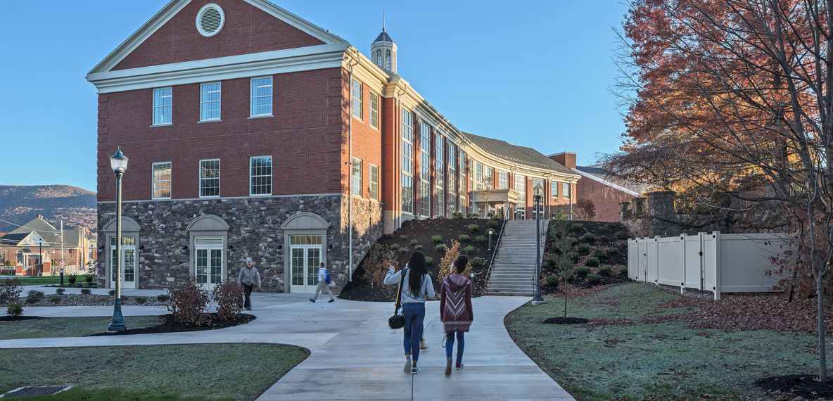 Two students walking through campus