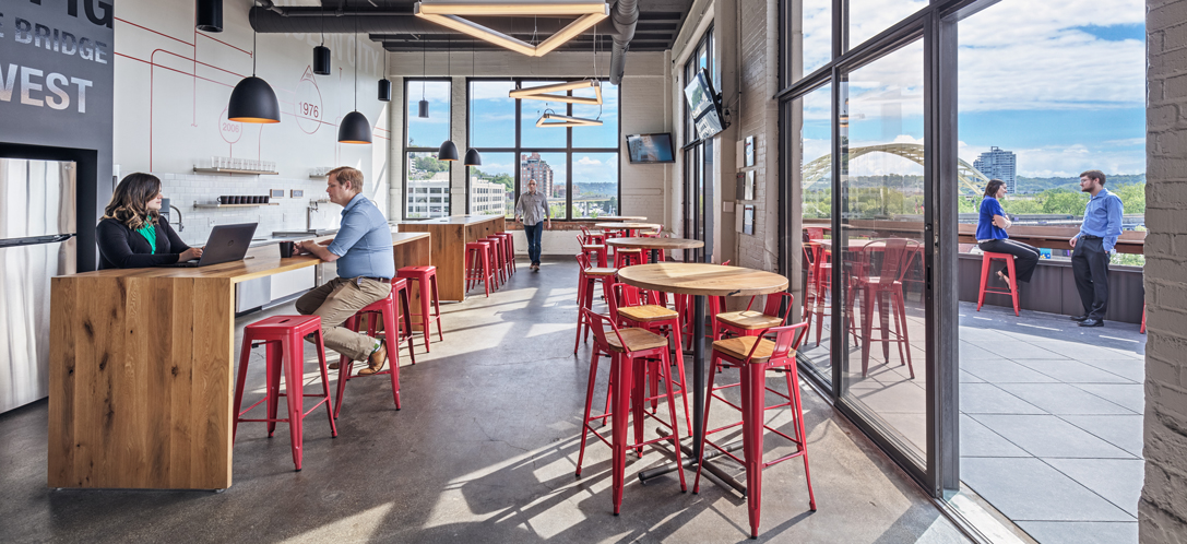 Employees congregate in the kitchen and outdoor space at Schaefer