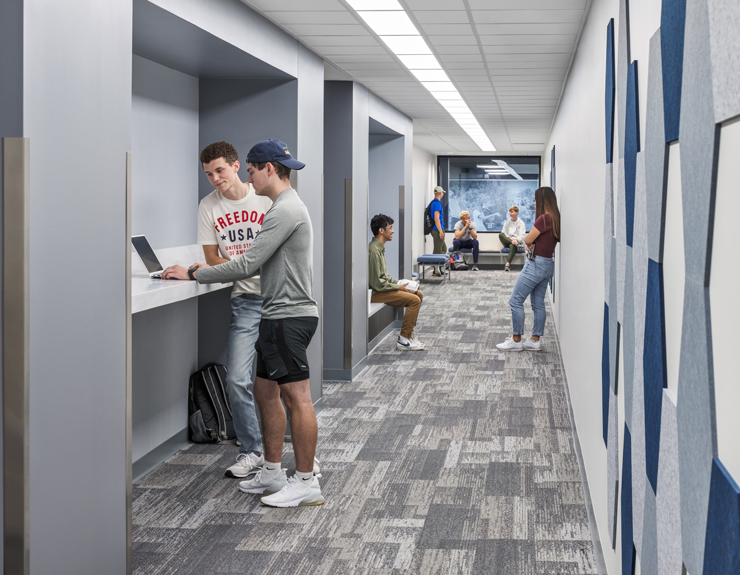 Students hang out in a hallway together