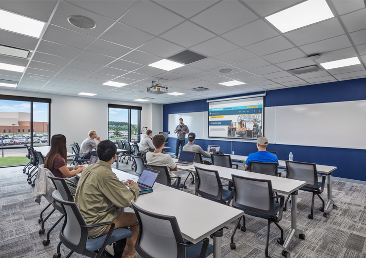 Students sit at desks in one of their new classrooms inside the Callan Athletic Center