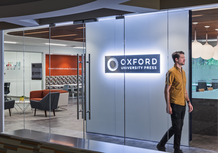 Large, transparent doors offer views into Oxford University Press' office 