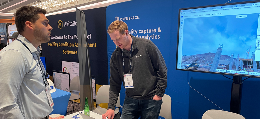 Adam receiving a demo from one of the conference’s booth sponsors “OpenSpace.”