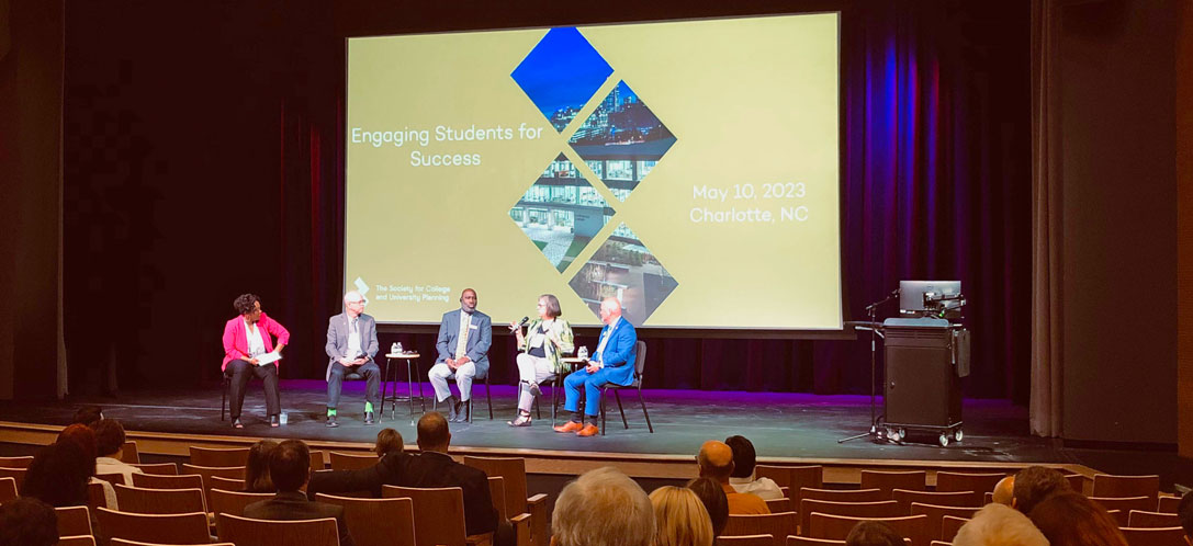 Panelists discuss "Engaging Students for Success" on stage
