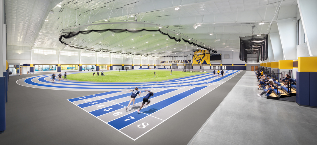 Student athletes prepare to run on the new indoor track at Mount St. Joseph University