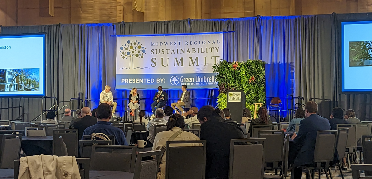 Speakers sit up on stage at the Midwest Regional Sustainability Summit