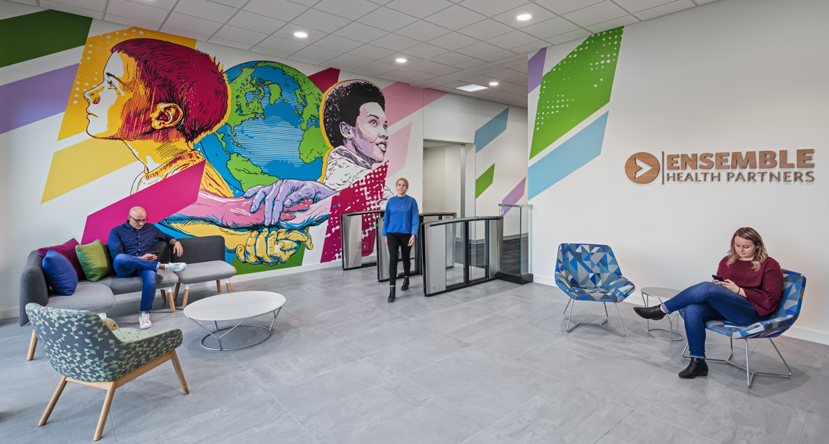 The guest entrance features a colorful mural