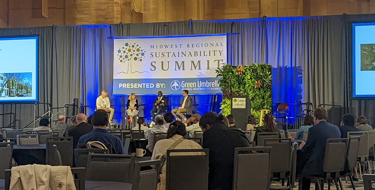 Speakers sit up on stage at the Midwest Regional Sustainability Summit
