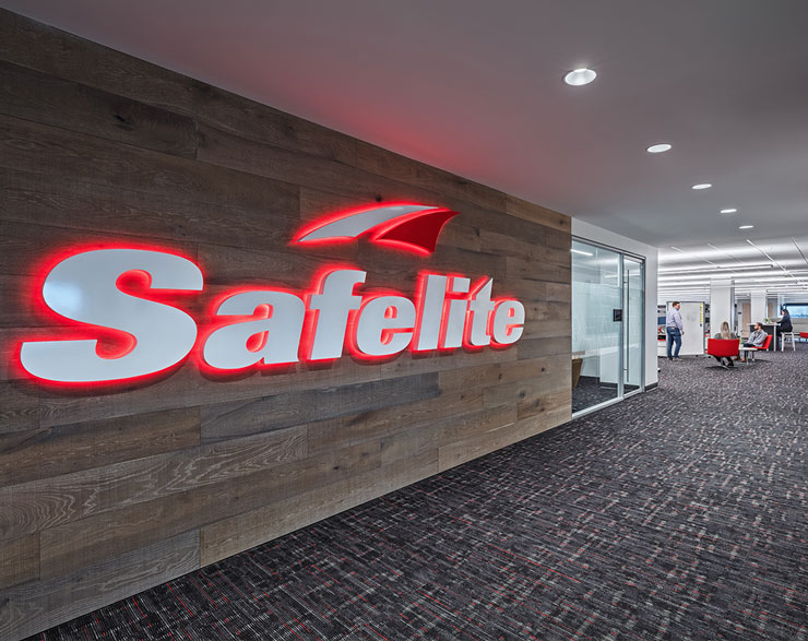 Safelite logo on wood wall