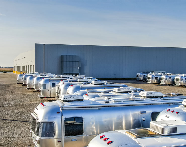 Airstreams lined up behind the facility