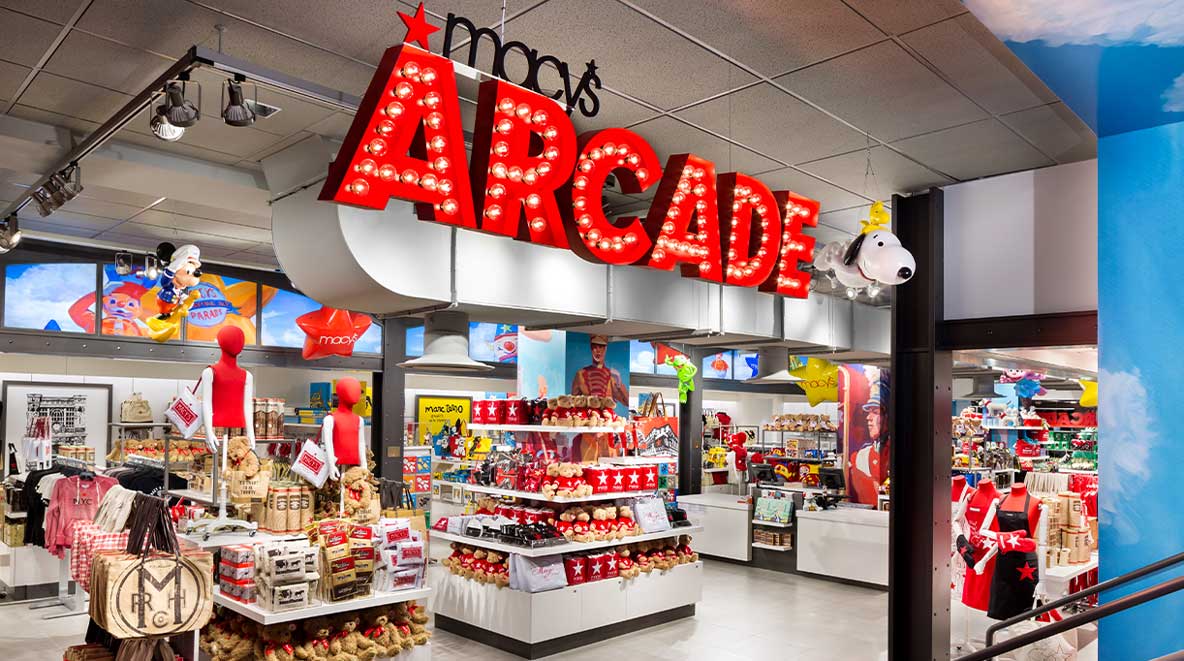 "Macy's Arcade" shines in big red letters above merchandise