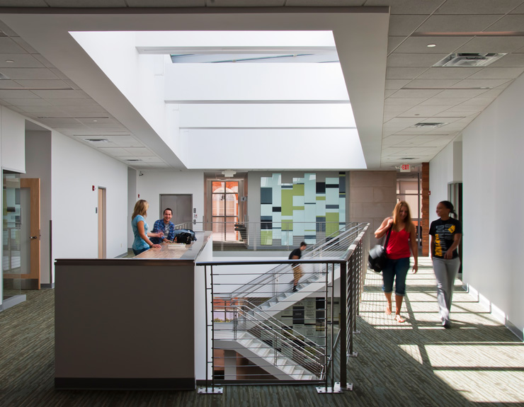 Above the staircase, there is a light-filled atrium