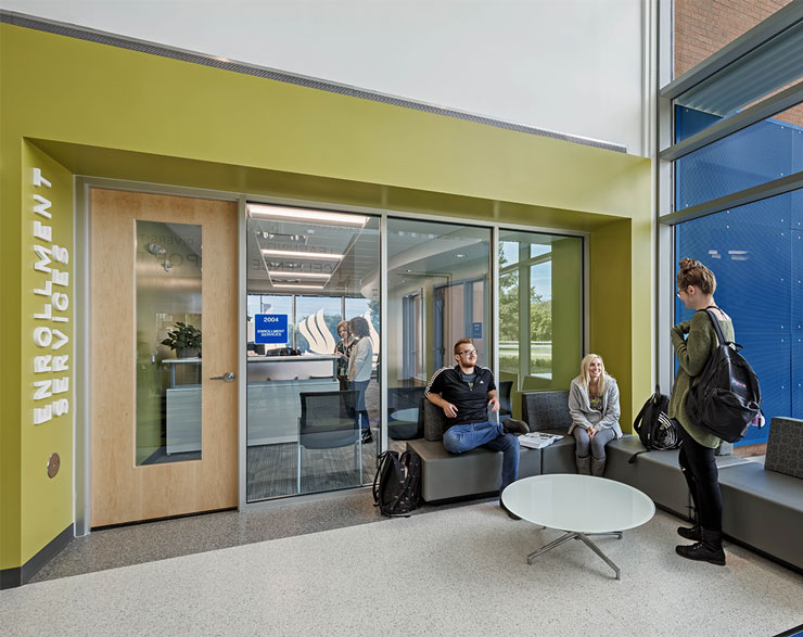 Students gather outside of the Enrollment Services area