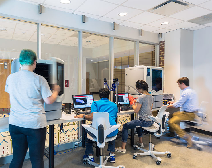 Students work together in a lab using imaging equipment