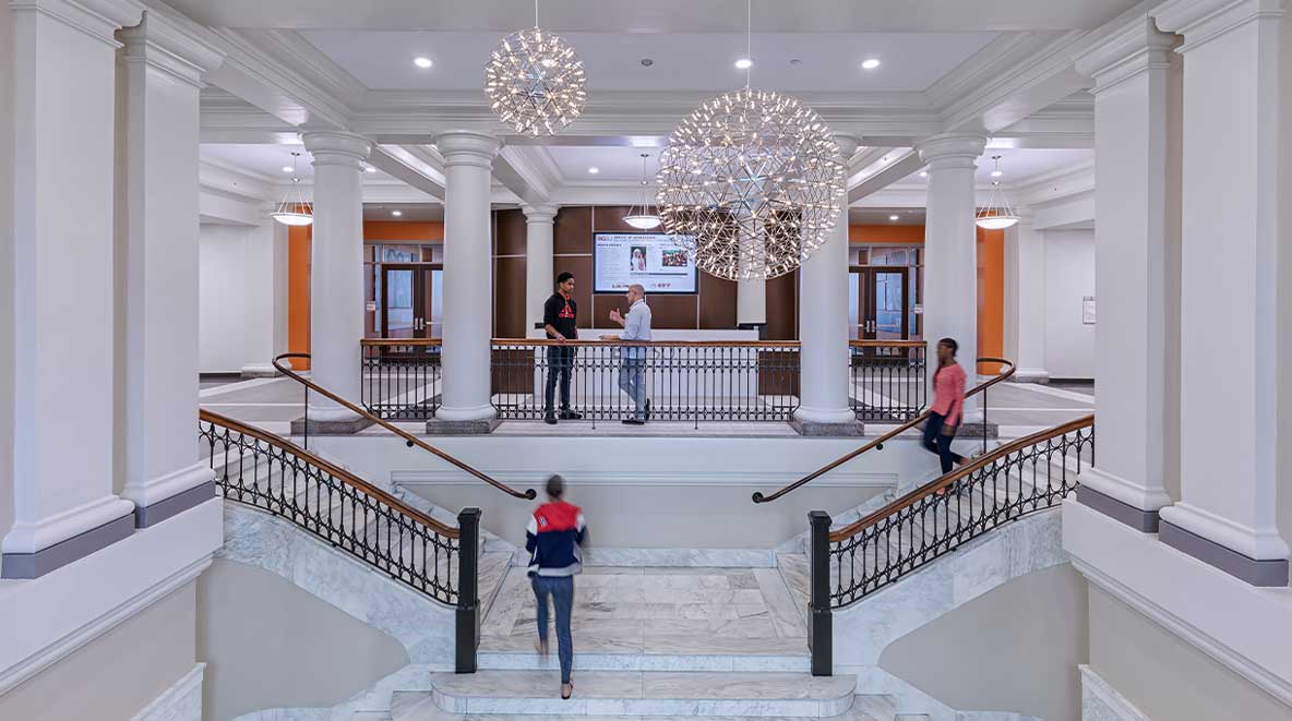 Students travel up the grand stair