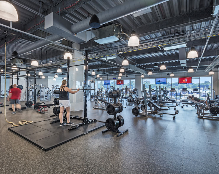 Employees work out in the new fitness center