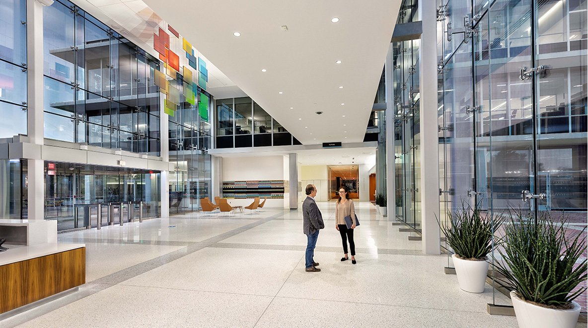 Employees have a conversation in Altria's new lobby