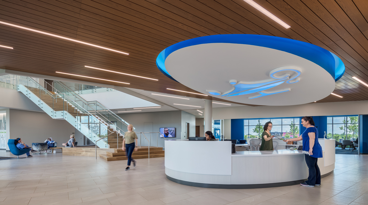 Inside Galen's headquarters, a large, circular receptionist desk welcomes students, faculty, and staff.