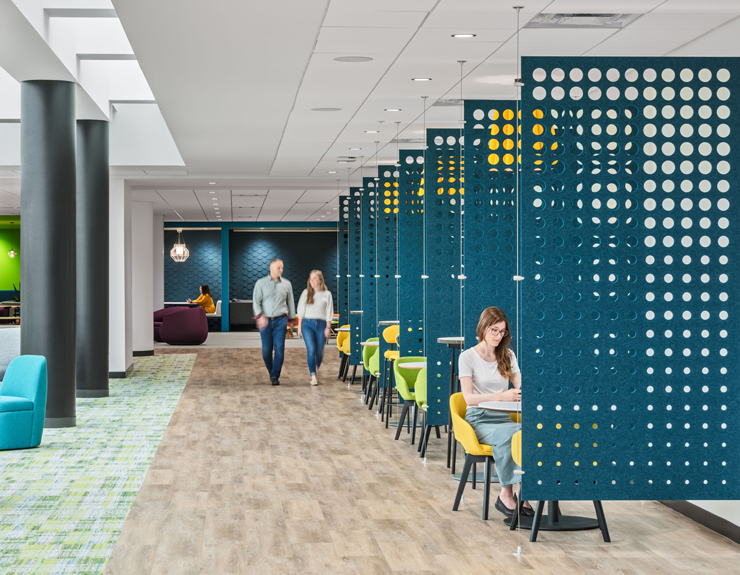 Employees walk through the lower level amenity space