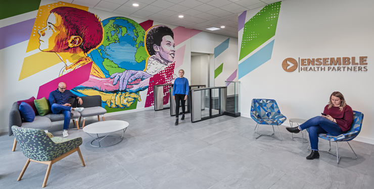 The welcoming lobby at Ensemble features a colorful mural