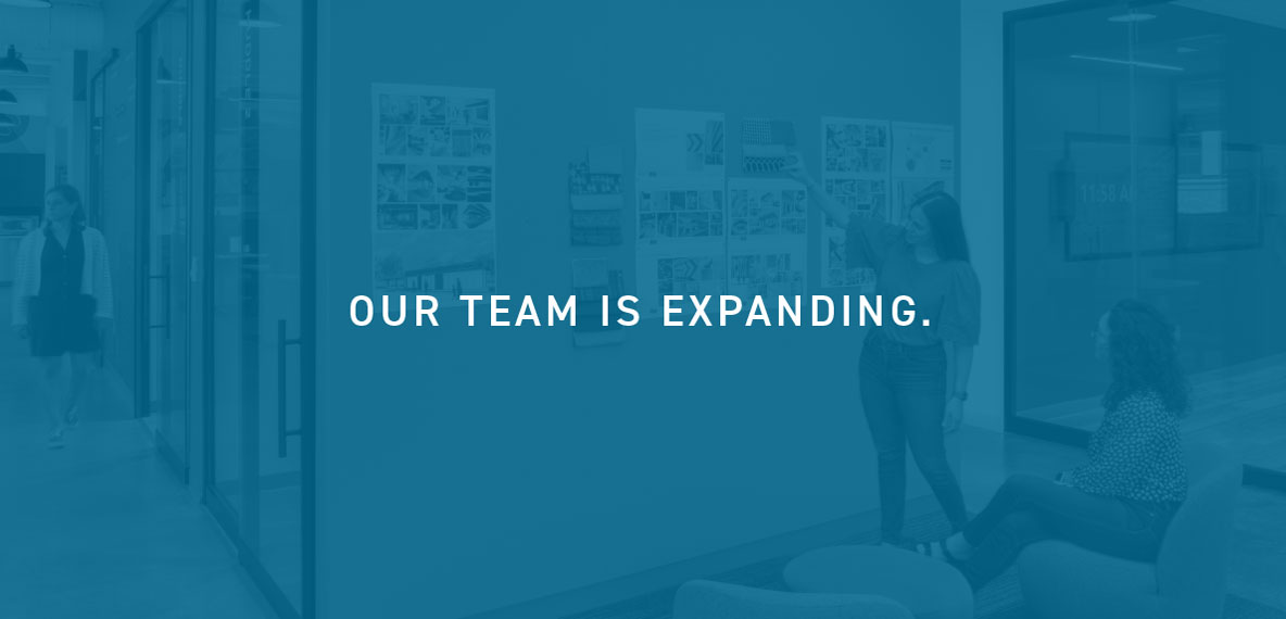 Photo of an office with the words "Our Team is Expanding."