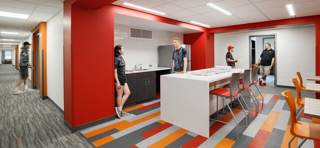 Students hanging out in a shared kitchen space