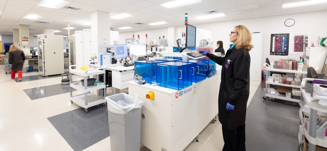 People working at the BSL3 Laboratory at UC Health