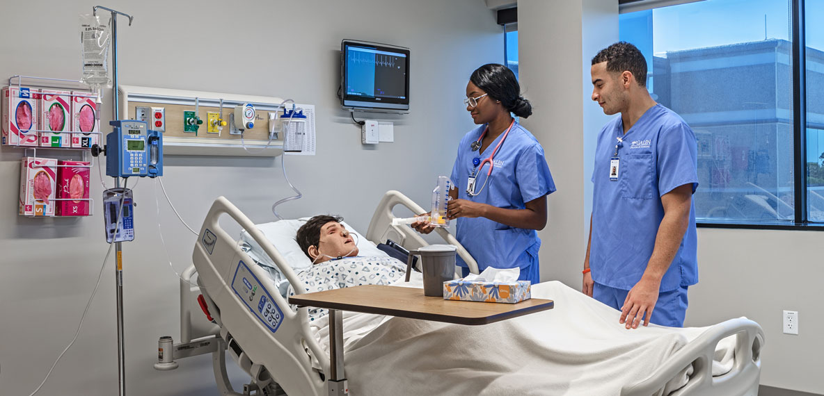 Two students in a nursing simulation lab at Galen College of Nursing Tampa campus