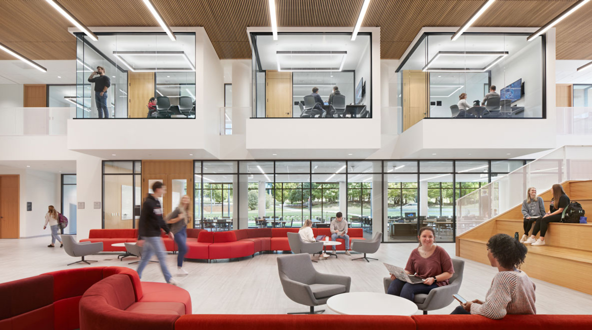 Students sitting in the lobby of the new University of Cincinnati Law Building