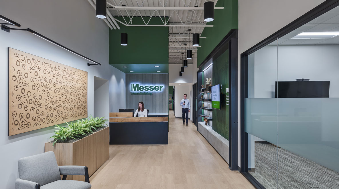 A woman working at the front desk of Messer Constructions' new Regional Office in Cincinnati, OH.