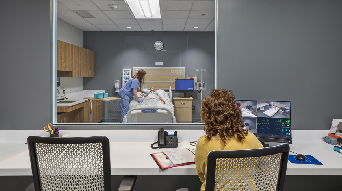 Nursing student working while being observed