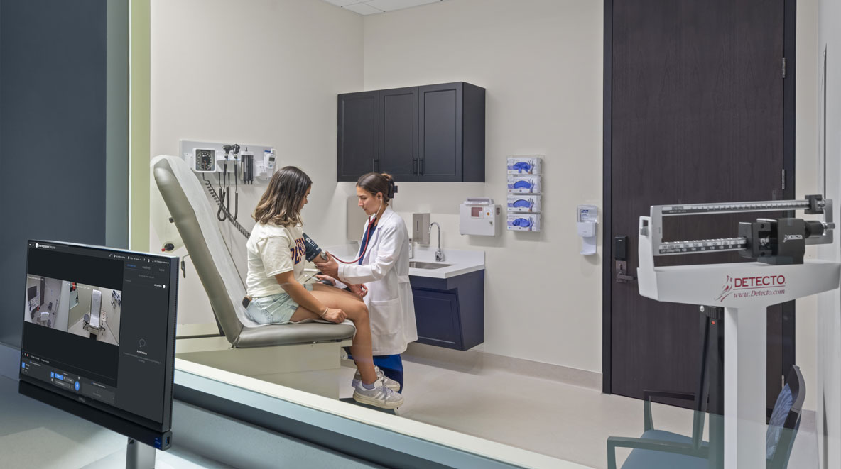 Students working in a patient simulation room at Pepperdine University's College of Health Sciences