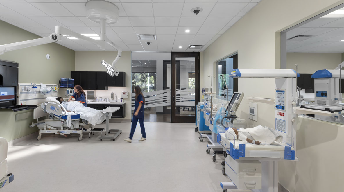 Students working in a patient simulation room at Pepperdine University's College of Health Sciences