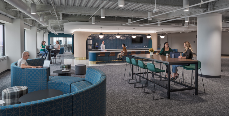 Employees gather in different areas of an employee amenities floor