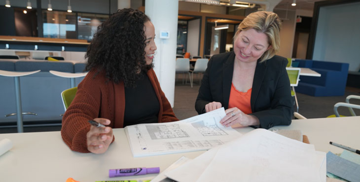 two women working on a project