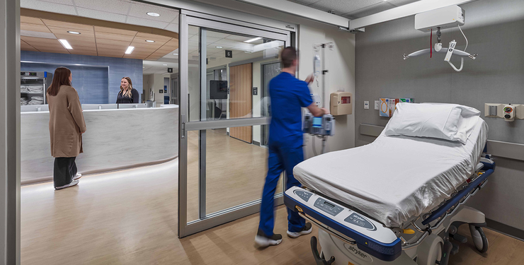 Image of interior of hospital room looking out at nurse's station