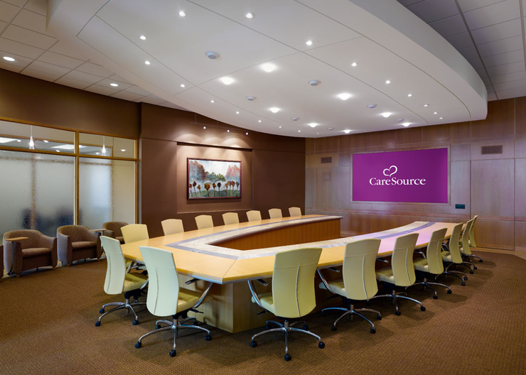 A conference room with a u-shaped table