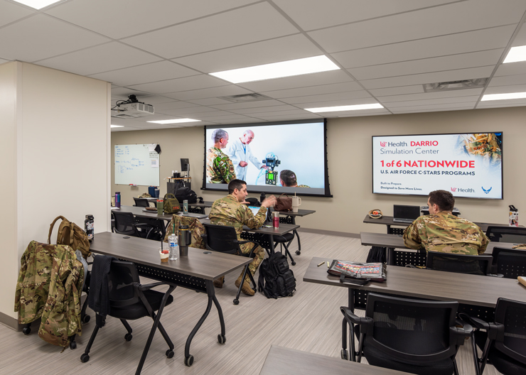 Students learning in classroom in military gear