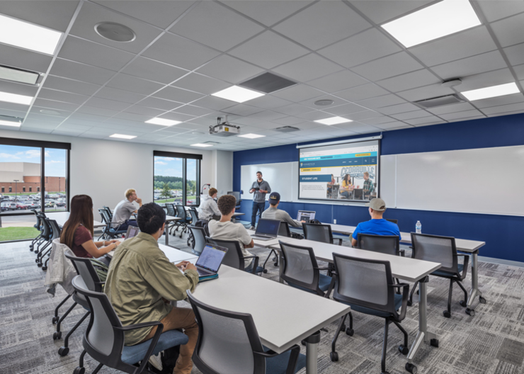 Students sit at desks in one of their new classrooms inside the Callan Athletic Center