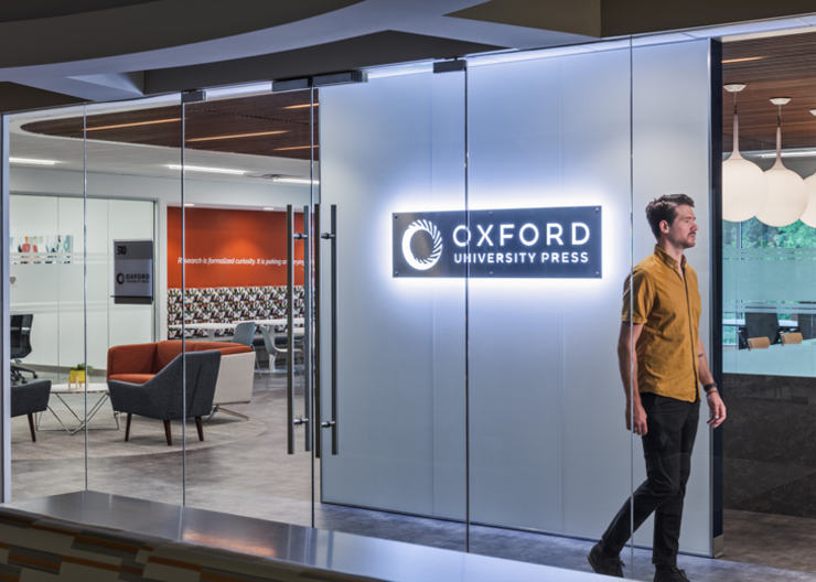 Large, transparent doors offer views into Oxford University Press' office 