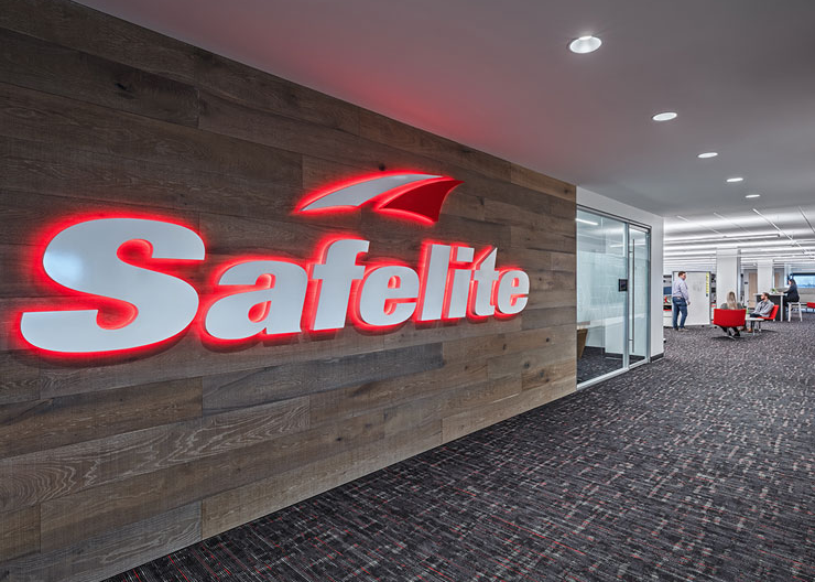 Safelite logo on wood wall
