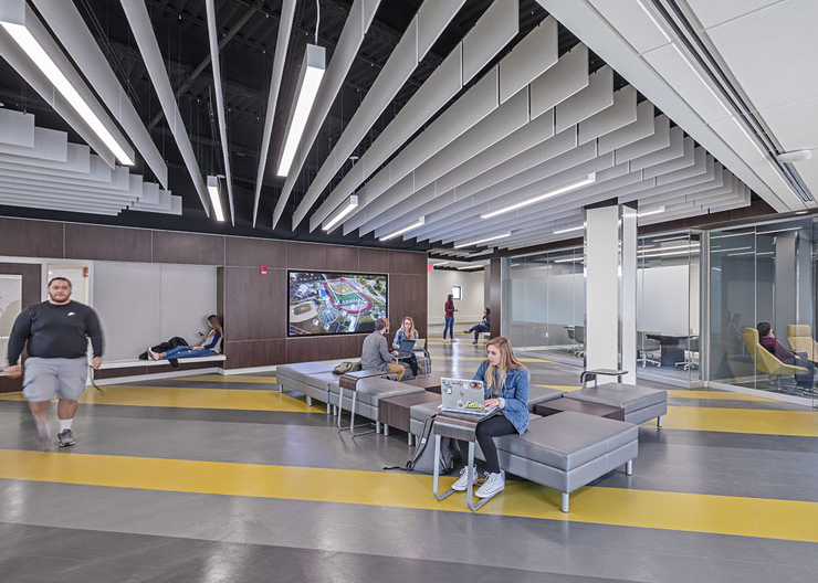 Students take advantage of the open work area with different nooks and huddle rooms