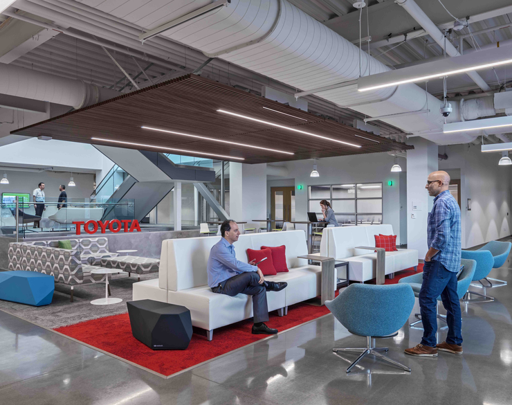 Two men interacting in the Toyota Georgetown Production Facility workspace