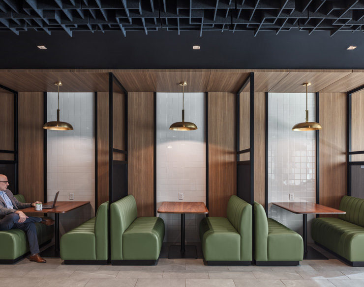 kitchen sitting area with green booths in the new summit client center