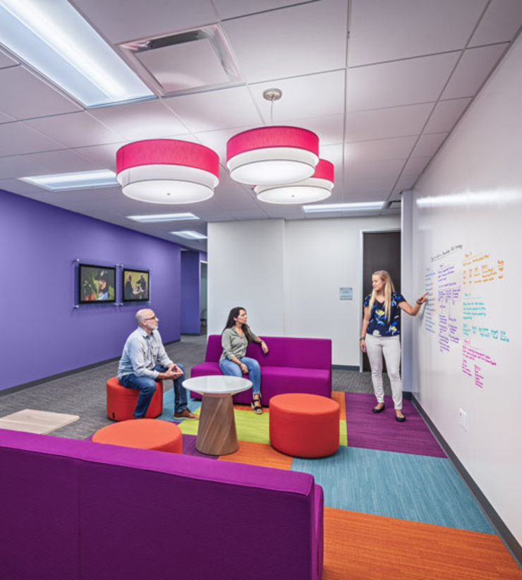 Interior view of colorful collaboration area within Aetna's renovated office
