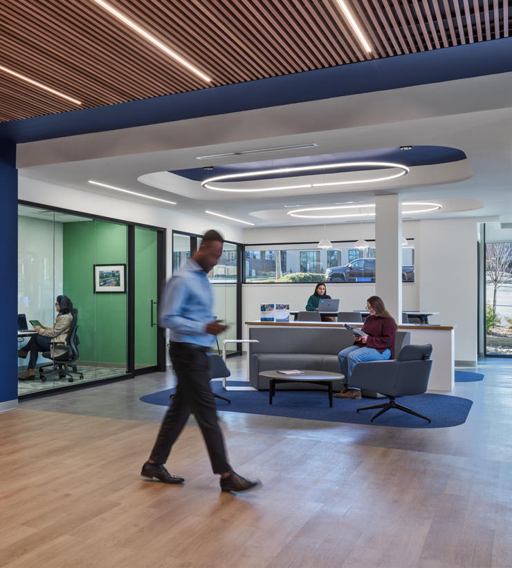 SECU's new open layout allows people to converse on comfy couches in the middle of the bank