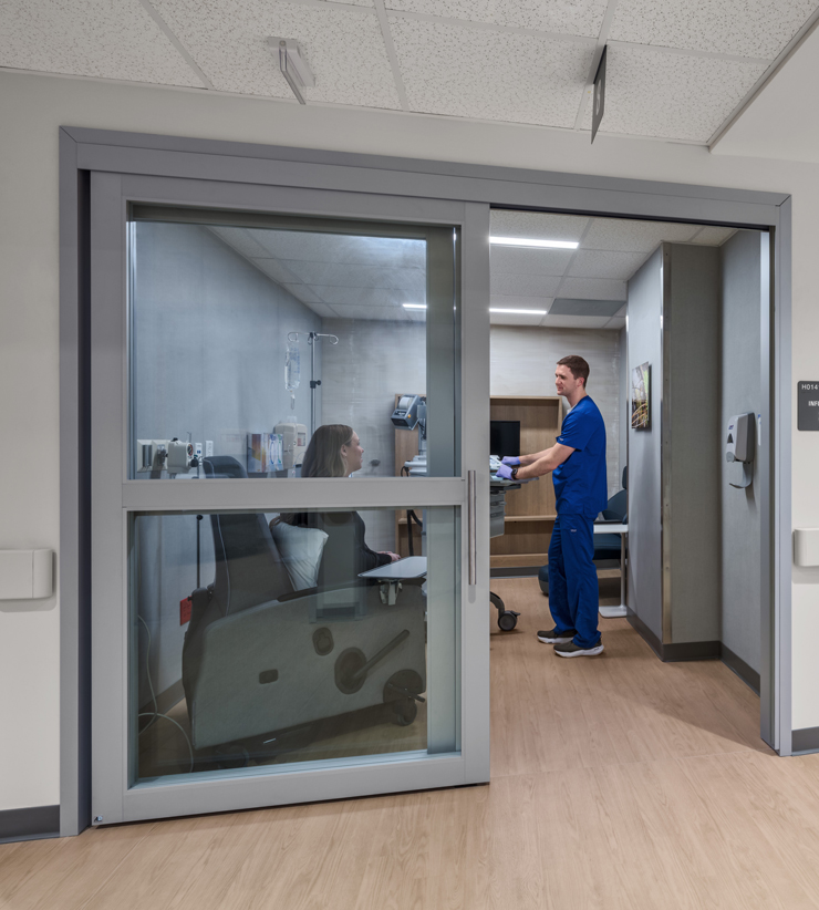Patient in infusion center room with nurse
