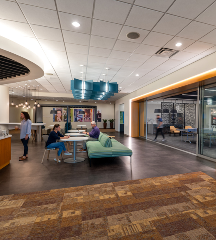 Employees sit in their new social hub